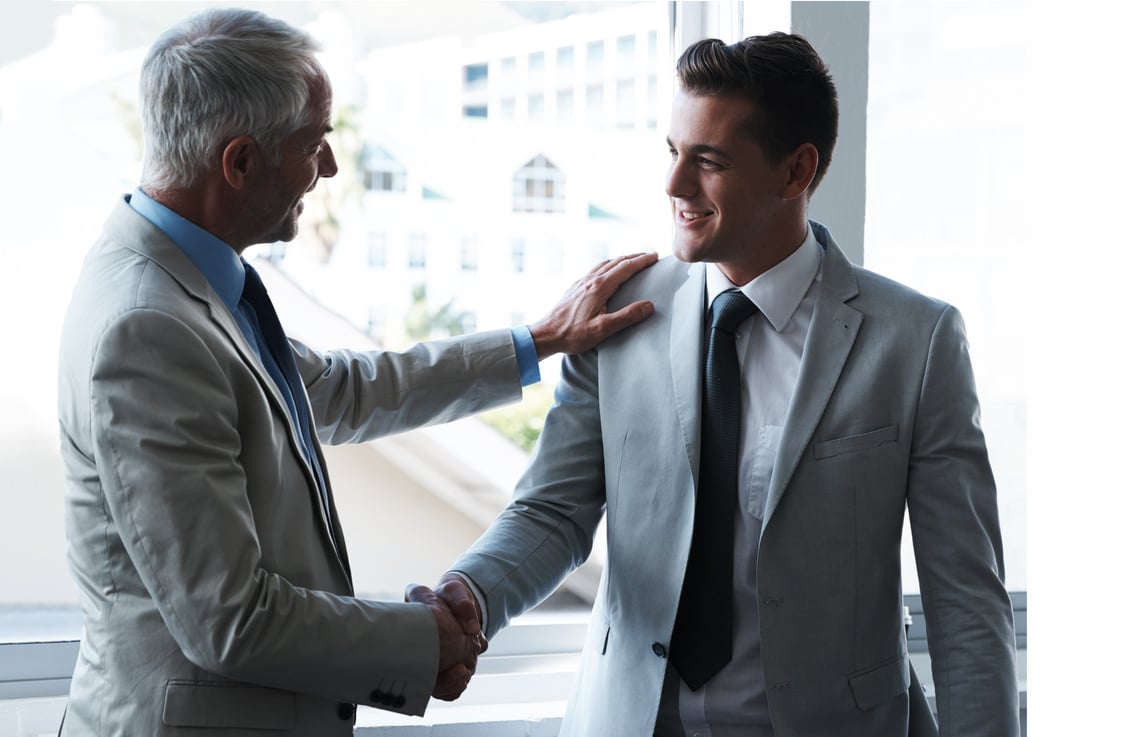 Building Business Relationships. Two Businessmen Shaking Hands.