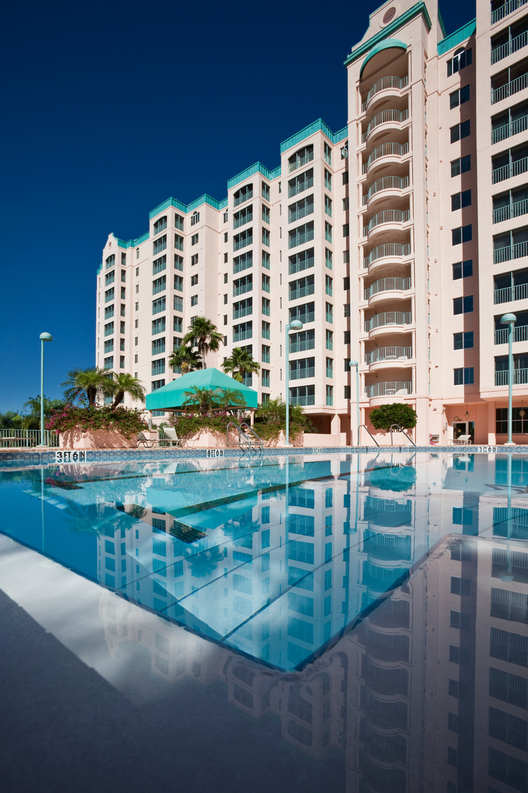 Wide Angle High Rise Condominium With Pool in Foreground