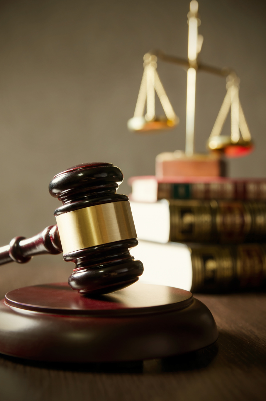 Wooden Gavel and Scales on Books